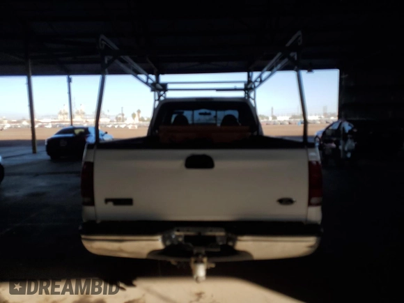1999 Ford F-250 XL with VIN 1FTNX20FXXEE59499, listed as a Copart auction lot 87511735 with 215,520 mi miles and Salvage title. Bid and sale history available at DreamBid. Image 6.