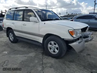 1999 Toyota Land Cruiser with VIN JT3HT05J7X0049786, listed as a Copart auction lot 45527005 with 199,447 mi miles and Salvage Title. Bid and sale history available at carsss.com. Image 4.