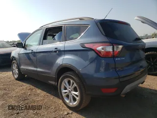 2018 Ford Escape SE z VIN 1FMCU9GD3JUA98865, wystawiony jako Copart lot #56842065 z przebiegiem 112 439 mil mil oraz Szkoda całkowita • Salvage title. Historia ofert i sprzedaży dostępna na DreamBid. Obrazek 2.