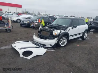 2014 MINI Cooper Countryman with VIN WMWZB3C55EWM32661, listed as a IAAI auction lot 41490239 with 93,109 mi miles. Bid and sale history available at carsss.com. Image 19.