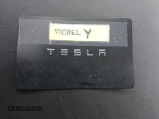 2021 Tesla Model Y Long Range with VIN 5YJYGDEE6MF122363, listed as a IAAI auction lot 41952018 with 54,263 mi miles and . Bid and sale history available at carsss.com. Image 11.