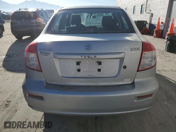 2010 Suzuki SX4 LE with VIN JS2YC5A27A6300498, listed as a Copart auction lot 43036655 with 237,647 mi miles and Salvage Title. Bid and sale history available at carsss.com. Image 6.