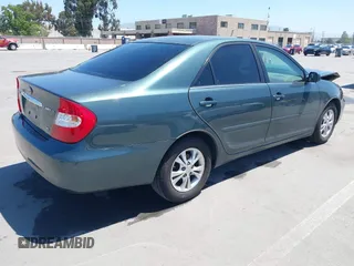 2004 Toyota Camry LE with VIN 4T1BF30K64U067898, listed as a IAAI auction lot 42131958 with 209,702 mi miles. Bid and sale history available at carsss.com. Image 4.