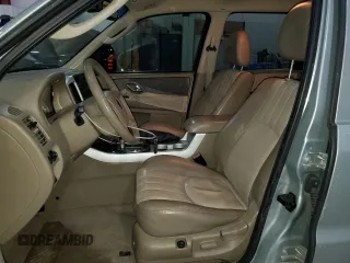 2005 Mercury Mariner Luxury z VIN 4M2CU57135DJ00228, wystawiony jako Copart lot #87603775 z przebiegiem 169 099 mil mil oraz Szkody całkowita. Historia ofert i sprzedaży dostępna na DreamBid. Obrazek 7.