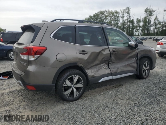 2021 Subaru Forester Touring z VIN JF2SKAXC0MH560263, wystawiony jako Copart lot #61453195 z przebiegiem Nie podano mil oraz Szkoda całkowita • Salvage title. Historia ofert i sprzedaży dostępna na DreamBid. Obrazek 3.