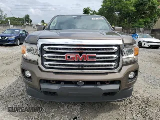2015 GMC Canyon 4WD SLE with VIN 1GTG6BE38F1263139, listed as a Copart auction lot 75479854 with 124,765 mi miles and Salvage Title. Bid and sale history available at carsss.com. Image 5.