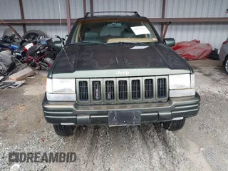 1997 Jeep Grand Cherokee Limited with VIN 1J4GZ78Y5VC723429, listed as a IAAI auction lot 42012836 with 231,126 mi miles. Bid and sale history available at carsss.com. Image 12.