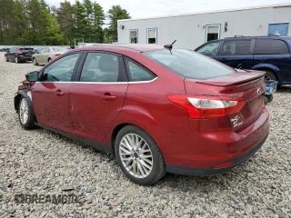 2014 Ford Focus Titanium with VIN 1FADP3J20EL352909, listed as a Copart auction lot 58501085 with 174,388 mi miles and Salvage title. Bid and sale history available at DreamBid. Image 2.