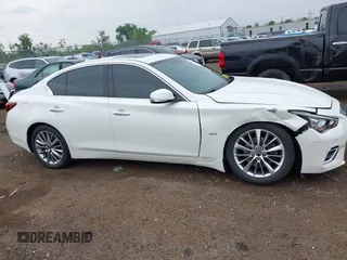 2018 Infiniti Q50 Luxe z VIN JN1EV7AR3JM445195, wystawiony jako IAAI lot #42228587 z przebiegiem 122 575 mil mil oraz . Historia ofert i sprzedaży dostępna na DreamBid. Obrazek 13.