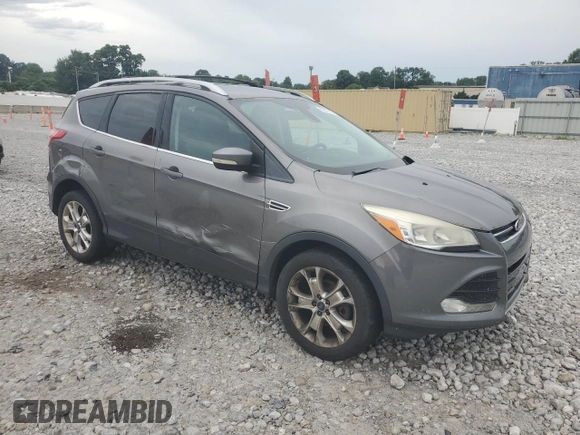 2013 Ford Escape SEL z VIN 1FMCU9HX7DUC11052, wystawiony jako Copart lot #62377515 z przebiegiem 225 704 mil mil oraz Szkoda całkowita • Salvage title. Historia ofert i sprzedaży dostępna na DreamBid. Obrazek 4.