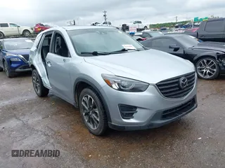 2016 Mazda CX-5 Grand Touring z VIN JM3KE4DY0G0664463, wystawiony jako IAAI lot #42192867 z przebiegiem 199 198 mil mil oraz . Historia ofert i sprzedaży dostępna na DreamBid. Obrazek 1.
