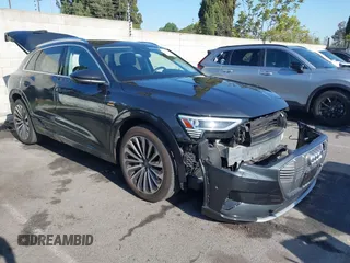 2019 Audi e-tron Prestige with VIN WA1VAAGE2KB021539, listed as a IAAI auction lot 42007353 with 14,238 mi miles and . Bid and sale history available at DreamBid. Image 1.