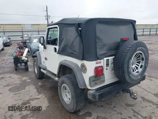 2005 Jeep Wrangler Sport with VIN 1J4FA49S25P320240, listed as a IAAI auction lot 41433371 with 144,552 mi miles. Bid and sale history available at carsss.com. Image 3.