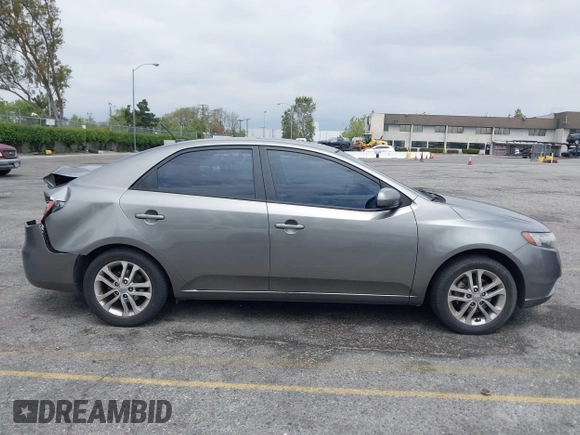 2012 Kia Forte EX with VIN KNAFU4A2XC5560585, listed as a IAAI auction lot 42121133 with 151,079 mi miles. Bid and sale history available at carsss.com. Image 13.
