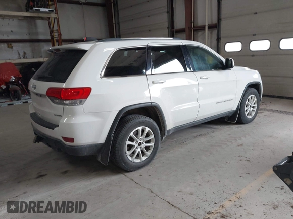 2014 Jeep Grand Cherokee Laredo with VIN 1C4RJFAG4EC309401, listed as a IAAI auction lot 41996233 with 243,541 mi miles and . Bid and sale history available at DreamBid. Image 4.