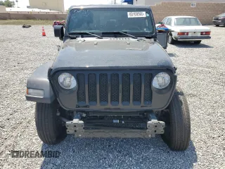 2023 Jeep Wrangler Willys with VIN 1C4HJXDN0PW631045, listed as a Copart auction lot 60109565 with 31,095 mi miles and Salvage title. Bid and sale history available at DreamBid. Image 5.