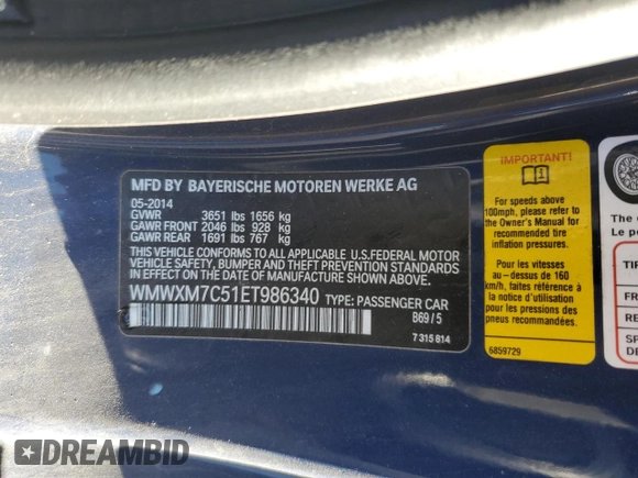 2014 MINI Hardtop S with VIN WMWXM7C51ET986340, listed as a Copart auction lot 42390825 with 71,558 mi miles and Salvage Title. Bid and sale history available at DreamBid. Image 13.