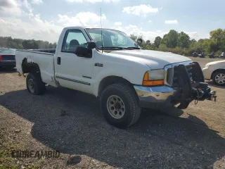 1999 Ford Super Duty F-250 XL with VIN 1FTNF21F8XED38956, listed as a Copart auction lot 69384214 with 143,127 mi miles and Salvage Title. Bid and sale history available at carsss.com. Image 4.