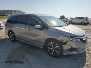 2018 Honda Odyssey Elite with VIN 5FNRL6H95JB062033, listed as a Copart auction lot 63732915 with 105,234 mi miles and Salvage title. Bid and sale history available at DreamBid. Image 4.