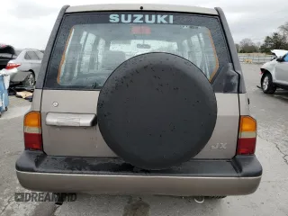 1997 Suzuki Sidekick JX z VIN 2S3TD03V4V6403519, wystawiony jako Copart lot #49666085 z przebiegiem 54 577 mil mil oraz Szkoda całkowita • Salvage title. Historia ofert i sprzedaży dostępna na DreamBid. Obrazek 6.