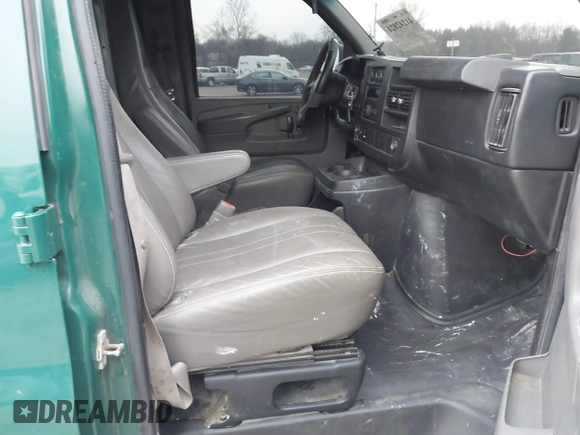 2014 Chevrolet Express Cargo Van with VIN 1GCWGGCAXE1198199, listed as a IAAI auction lot 41242821 with 274,446 mi miles. Bid and sale history available at carsss.com. Image 5.
