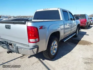 2013 GMC Sierra 1500 SLT with VIN 3GTP2WE78DG323280, listed as a IAAI auction lot 41148621 with 143,491 mi miles. Bid and sale history available at carsss.com. Image 4.