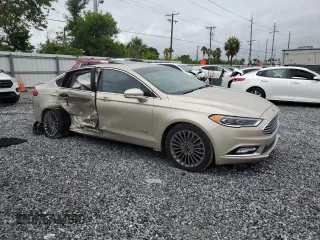 2017 Ford Fusion Hybrid Titanium with VIN 3FA6P0RU5HR359714, listed as a Copart auction lot 59156975 with 84,220 mi miles and Salvage title. Bid and sale history available at DreamBid. Image 4.