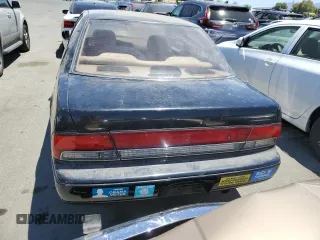 1993 Nissan Maxima z VIN JN1HJ01F6PT114020, wystawiony jako Copart lot #61137914 z przebiegiem 230 999 mil mil oraz Tytuł czysty. Historia ofert i sprzedaży dostępna na DreamBid. Obrazek 6.