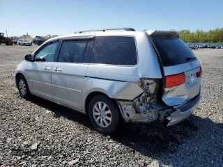 2010 Honda Odyssey EX-L with VIN 5FNRL3H76AB114542, listed as a Copart auction lot 54785425 with 104,239 mi miles and Salvage Title. Bid and sale history available at DreamBid. Image 2.