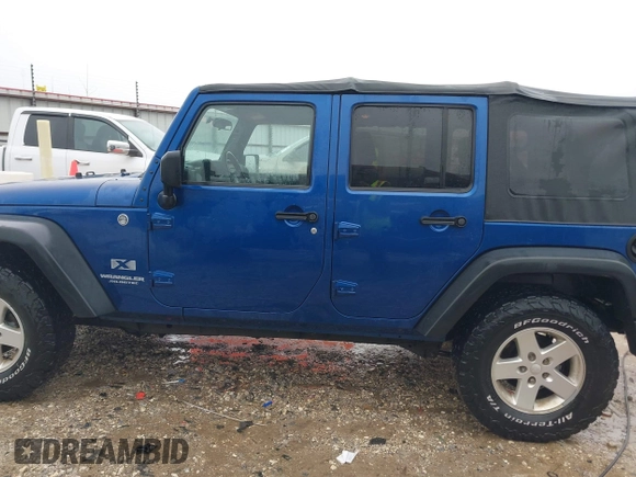 2009 Jeep Wrangler Unlimited X with VIN 1J4GA39189L787777, listed as a IAAI auction lot 41570579 with 193,163 mi miles. Bid and sale history available at carsss.com. Image 14.