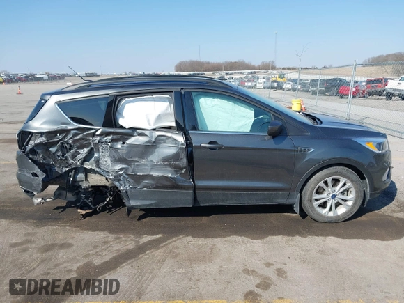 2018 Ford Escape SE z VIN 1FMCU9GD6JUD55937, wystawiony jako IAAI lot #41898592 z przebiegiem 37 800 mil mil oraz . Historia ofert i sprzedaży dostępna na DreamBid. Obrazek 14.