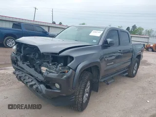 2018 Toyota Tacoma SR5 with VIN 5TFAZ5CN5JX062498, listed as a IAAI auction lot 41867393 with 128,879 mi miles and . Bid and sale history available at DreamBid. Image 2.