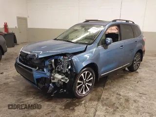 2017 Subaru Forester Touring with VIN JF2SJGTC9HH410251, listed as a IAAI auction lot 41411079 with 131,220 mi miles and . Bid and sale history available at DreamBid. Image 2.