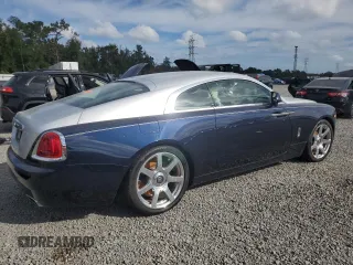 2014 Rolls-Royce Wraith z VIN SCA665C55EUX84597, wystawiony jako Copart lot #79843344 z przebiegiem Nie podano mil oraz Szkody całkowita. Historia ofert i sprzedaży dostępna na DreamBid. Obrazek 3.