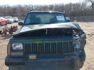 1996 Jeep Cherokee Sport with VIN 1J4FJ68S2TL299150, listed as a IAAI auction lot 41932867 with 142,761 mi miles. Bid and sale history available at carsss.com. Image 12.