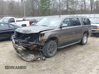 2015 Chevrolet Suburban LT z VIN 1GNSCJKC6FR675585, wystawiony jako IAAI lot #41510570 z przebiegiem 156 818 mil mil oraz . Historia ofert i sprzedaży dostępna na DreamBid. Obrazek 19.