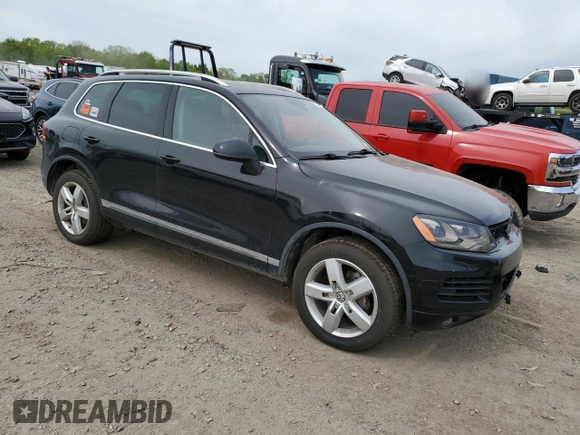 2012 Volkswagen Touareg Sport with VIN WVGFF9BP8CD001039, listed as a Copart auction lot 57764125 with 128,540 mi miles and Clean title. Bid and sale history available at DreamBid. Image 4.