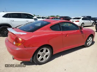 2003 Hyundai Tiburon GT z VIN KMHHN65F53U041351, wystawiony jako Copart lot #52332395 z przebiegiem 194 821 mil mil oraz Czysty tytuł • Clean title. Historia ofert i sprzedaży dostępna na DreamBid. Obrazek 3.
