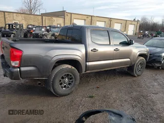 2016 Toyota Tacoma SR5 with VIN 5TFAX5GN1GX056450, listed as a IAAI auction lot 41215339 with 129,604 mi miles. Bid and sale history available at carsss.com. Image 4.