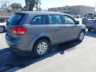 2013 Dodge Journey SE with VIN 3C4PDCAB7DT730744, listed as a IAAI auction lot 41900114 with 186,086 mi miles and . Bid and sale history available at DreamBid. Image 4.