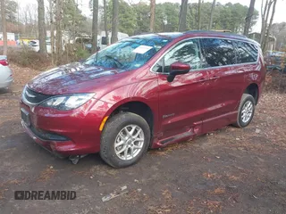 2021 Chrysler Voyager LXi with VIN 2C4RC1DG1MR556020, listed as a IAAI auction lot 41044760 with 6,286 mi miles and . Bid and sale history available at DreamBid. Image 2.