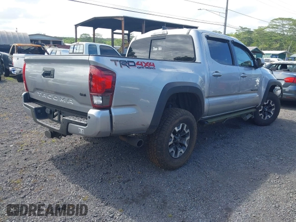 2018 Toyota Tacoma SR z VIN 3TMCZ5AN7JM156092, wystawiony jako IAAI lot #41642391 z przebiegiem 65 805 mil mil oraz . Historia ofert i sprzedaży dostępna na DreamBid. Obrazek 4.