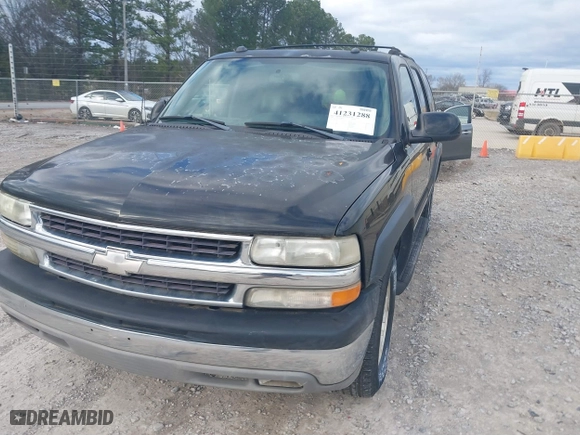 2004 Chevrolet Tahoe LT with VIN 1GNEC13Z74J314927, listed as a IAAI auction lot 41231288 with 195,809 mi miles. Bid and sale history available at carsss.com. Image 6.