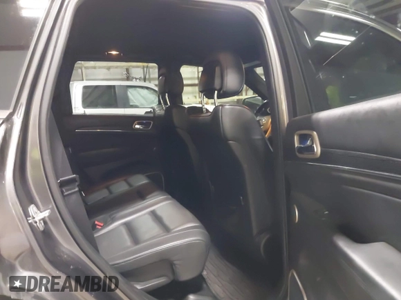 2015 Jeep Grand Cherokee Summit with VIN 1C4RJFJT6FC754799, listed as a IAAI auction lot 41699124 with 124,206 mi miles and . Bid and sale history available at DreamBid. Image 8.