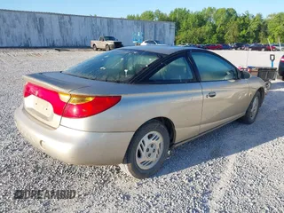 2001 Saturn SC with VIN 1G8ZR12741Z248708, listed as a IAAI auction lot 42044365 with 200,697 mi miles. Bid and sale history available at carsss.com. Image 4.
