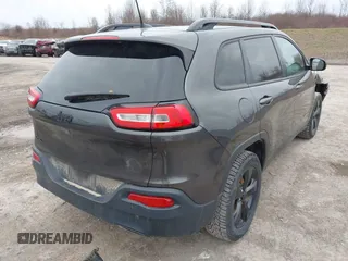 2016 Jeep Cherokee 75th Anniversary with VIN 1C4PJMCB0GW156076, listed as a IAAI auction lot 41946760 with 105,571 mi miles. Bid and sale history available at carsss.com. Image 4.