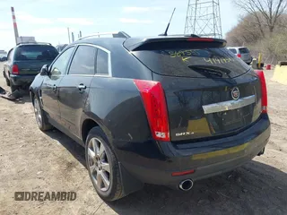2012 Cadillac SRX Performance Collection z VIN 3GYFNEE31CS569555, wystawiony jako IAAI lot #41919585 z przebiegiem 126 991 mil mil oraz . Historia ofert i sprzedaży dostępna na DreamBid. Obrazek 3.