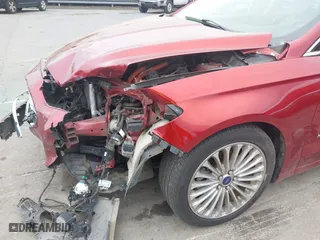 2014 Ford Fusion Titanium Hybrid with VIN 3FA6P0RU9ER349599, listed as a IAAI auction lot 41928864 with 94,312 mi miles. Bid and sale history available at carsss.com. Image 13.
