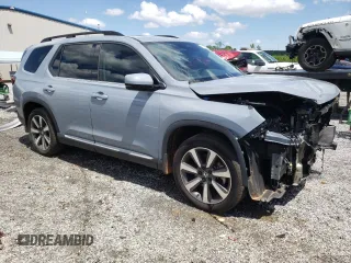 2023 Honda Pilot Touring with VIN 5FNYG2H78PB006054, listed as a Copart auction lot 56039785 with 35,831 mi miles and Salvage title. Bid and sale history available at DreamBid. Image 4.
