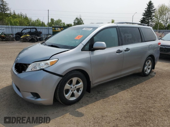 2014 Toyota Sienna L with VIN 5TDZK3DC8ES442973, listed as a Copart auction lot 59660055 with 310,496 mi miles and Salvage title. Bid and sale history available at DreamBid. Image 1.